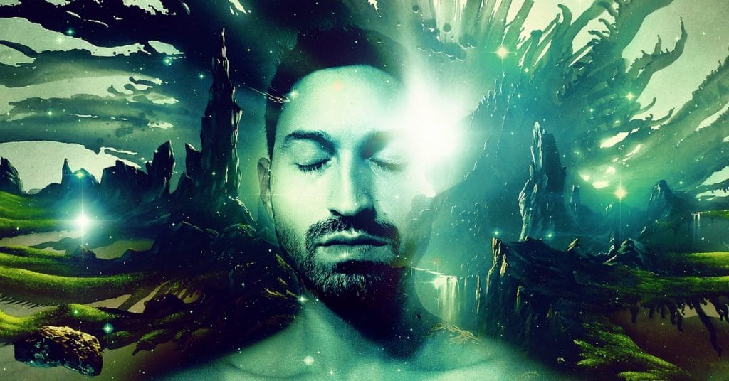 Bearded man with his eyes closed surrounded by green lights mountains and the universe in the background